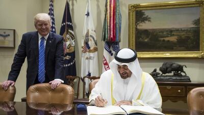Sheikh Mohamed bin Zayed, Crown Prince of Abu Dhabi and Deputy Supreme Commander of the UAE Armed Forces, signs the guest book upon arriving at the White House for a meeting with US president Donald Trump on May 15, 2017. Ryan Carter / Crown Prince Court - Abu Dhabi