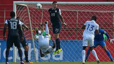 Juan Carlos Garcia scores for Honduras against the USA during their World Cup qualifier at Estadio Olimpico Metropolitano.