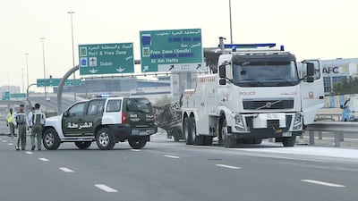 The lorry, which can be seen here being loaded on to the back of a police vehicle, caught fire after suffering a tyre blowout. The National staff