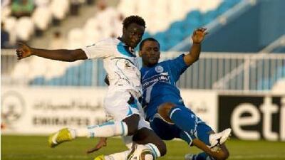 Andre Senghor, left, the Baniyas striker, scores the only goal against Al Nasr on Tuesday.