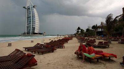 A couple at the Madinat Jumeirah beach in Dubai. Stephen Lock / The National