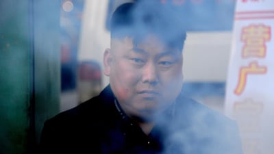 North Korean leader Kim Jong-Un strikes fear into some hearts, but photos of a Chinese street food vendor with a distinct resemblance to the Pyongyang strongman have fuelled online mirth. AFP Photo