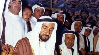 Sheikh Zayed signs the Federation Agreement on December 2, 1971, creating the UAE. On his left is Sheikh Rashid, then Ruler of Dubai. Behind them are Mehdi Al Tajir, Sheikh Maktoum bin Rashid and Sheikh Hamdan bin Rashid.