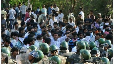 Policemen try to stop the progress of students in Hyderabad, Andhra Pradesh, yesterday.