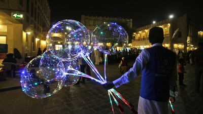 A vendor sells balloons at the Waqif Souq, in Doha. Qatar’s banking system in May registered the softest credit growth in years, confirming a weak earnings outlook this year. (AP Photo / Kamran Jebreili)