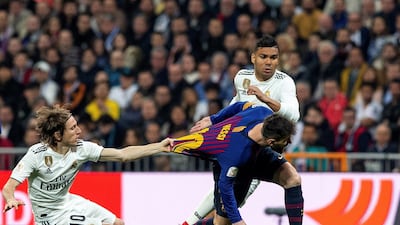 Barcelona's Lionel Messi, right, in action against Real Madrid's Luka Modric during the semi-final second leg of the Copa del Rey. Barcelona won the match at Madrid's Bernabeu 3-0 to advance 4-1 on aggregate. Reuters