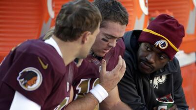 Washington first turned to Kirk Cousins, left, when Robert Griffin III, right, was injured in Week 2. Colt McCoy, centre, came in for an ineffective Cousins in Week 7. Pablo Martinez Monsivais / AP Photo