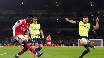 Arsenal substitute Bukayo Saka has a cross charged down by FC Zurich's Fidan Aliti. PA