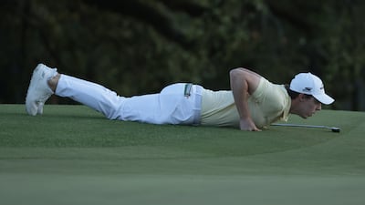 Matthew Fitzpatrick lines up a putt on the 18th green. EPA