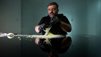 Omar Sartawi, a Jordanian chef, recreates an ancient statue found in Jordan using a famous local product - Jameed (dried goat's milk used in the country's national dish), at his workshop in Amman, Jordan. REUTERS