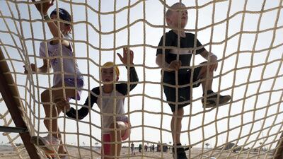 Kids compete and enjoy the obstacles and challenges on the Mini Mudder course.