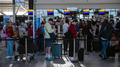 Passengers queues at Heathrow Airport in London. Bloomberg