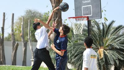 Boys playing basketball at the festival site.