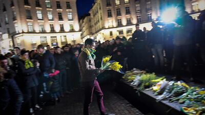 A Nantes supporter adds to the collection of flowers. AFP