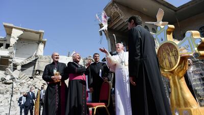 Pope Francis releases a white dove during a prayer for war victims at 'Hosh al-Bieaa', Church Square, in Mosul's Old City. Reuters