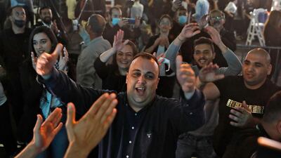 Supporters of Israel's predominantly Arab Joint List electoral alliance celebrate at their campaign headquarters in the Arab northern Israeli city of Shefa Amr. AFP