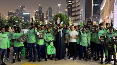 Tarik Toptas, centre, in white T-shirt, believes a small gesture can go a long way. Photo: Careem
