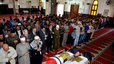 Citizens and dignitaries attend the funeral of two Egyptians killed by a mortar attack in Sinai (Ismailia Governor's office via AP)