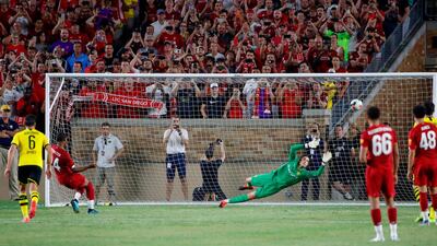 Rhian Brewster scores from the penalty spot for Liverpool in their 3-2 friendly loss to Borussia Dortmund. AFP