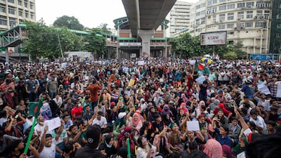 People shout slogans demanding justice after the more than 300 people were killed in the recent wave of clashes. AP