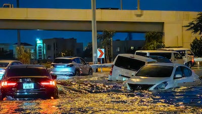 Cars drive in a flooded street following heavy rain in Dubai. In a claim involving natural calamity, the insurer has no recovery rights. AFP