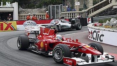Michael Schumacher follows Fernando Alonso in the Monaco Grand Prix on Sunday before overtaking the Ferrari driver.