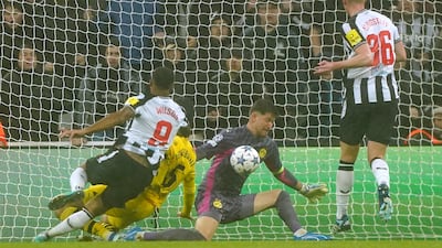Newcastle subsitute Callum Wilson has a shot saved by Dortmund keeper Gregor Kobel on second half. PA