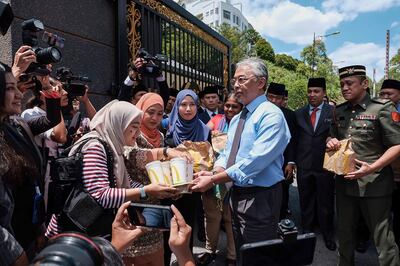 Mahathir Mohamad handed in his resignation to Malaysia’s King Sultan Abdullah Sultan Ahmad Shah, centre, in protest and left his own party for good measure. AFP