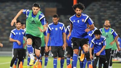 Mohanad Salem, left, and Hamdan Al Kamali go through their training session during a UAE national football team practice prior to their match against Uzbekistan. Courtesy UAE FA