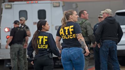 Officers from the Bureau of Alcohol, Tobacco, Firearms and Explosives, better known as ATF, arrive at the scene of the shooting. AP