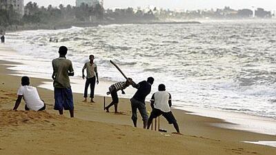 Beach cricket in Colombo - a popular version of Sri Lanka's sporting obsession. Deshakalyan Chowdhury / AFP