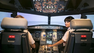 Ghada Mohamed Al Rousi says her position as second officer with Air Arabia gives her a good opportunity to gain flying time she needs, with experience of a variety of routes. Reem Mohammed / The National