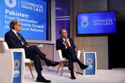 Muhammad Aurangzeb, Pakistan's Finance Minister, right, during the annual meetings of the IMF and World Bank in Washington. Bloomberg