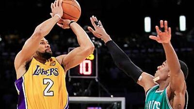 Los Angeles Lakers' Derek Fisher shoots over Boston Celtics' Rajon Rondo during the fourth quarter in Game 7.