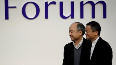 SoftBank Group founder and CEO Masayoshi Son and Alibaba founder and former chairman Jack Ma attend the Tokyo Forum 2019. Mr Ma is leaving the board of the Japanese group. Reuters
