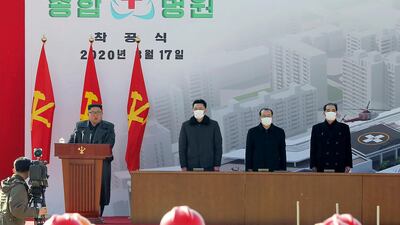 In this March 17 photo provided by the North Korean government, leader Kim Jong Un, left, delivers a speech during the ceremony of a general hospital in Pyongyang, North Korea. North Korea says it has zero coronavirus infections, but experts say it’s likely the virus has already spread in the country. Korean Central News Agency/AP