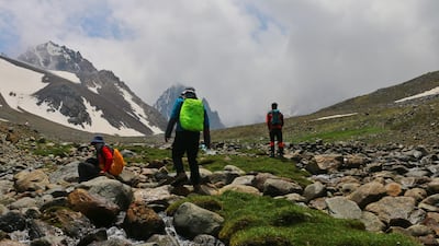 Zabih Afzali, pictured on the right, with friends, on the expedition up Mount Shah Fuladi, June 2020. Courtesy Zabih Afzali