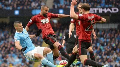 Sergio Aguero of Manchester City challenges for the ball with Sandro of West Bromwich Albion during the Premier League match between Manchester City and West Bromwich Albion at the Etihad Stadium on April 9, 2016 in Manchester, England. (Photo by Gareth Copley/Getty Images)