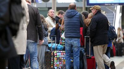Travellers crowd at the main train station in Hamburg. Many flight passengers were forced to take trains after Lufthansa pilot began a three-day work stoppage. Bodo Marks / AFP
