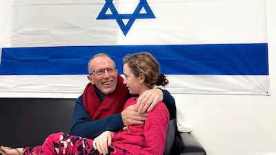 Emily Hand is reunited with her father, Thomas, after being held hostage in Gaza. Photo: Israeli army via AP