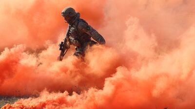 DRAWSKO POMORSKIE, POLAND - FEBRUARY 26: A soldier of the United Kingdom's 2nd Battalion Royal Anglian infantry unit storms an enemy position in a simulated attack during the NATO "Brilliant Jump" military exercises on February 26, 2024 in Drawsko Pomorskie, Poland. Brilliant Jump is combining forces from the United Kingdom, Poland, Spain, Albania and Turkey under NATO's Very High Readiness Joint Task Force (Land) (VJTF(L)). Brilliant Jump is part of the ongoing NATO Steadfast Defender exercise, with is involving 90,000 troops in maneuvers across Europe. (Photo by Sean Gallup / Getty Images)