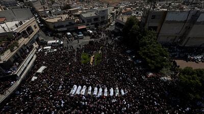 Mourners at the funeral of children and teens killed in a rocket strike at a football field, in Majdal Shams. AP