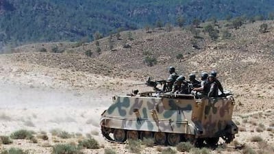 Tunisian soldiers patrol in the Mount Chaambi region, where they have been tracking militants the government says are veterans of the Islamist rebellion in northern Mali with links to Al Qaeda.