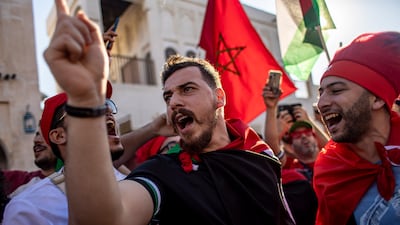 Fans of Morocco cheer at the Souq Waqif market. EPA