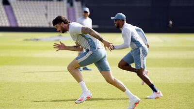 England's Reece Topley takes part in a training drill. PA