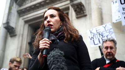 Stella Morris, partner of Julian Assange, speaks to the media. Reuters