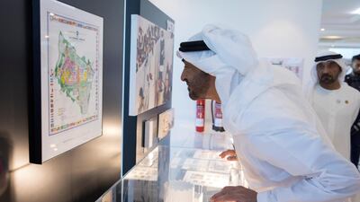 Sheikh Mohammed bin Zayed, Crown Prince of Abu Dhabi and Deputy Supreme Commander of the UAE Armed Forces, views a map during a visit to the Expo 2020 main office in Jebel Ali. Hamad Al Mansoori for The Crown Prince Court