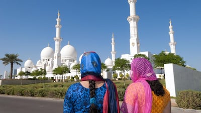 Above, Indian tourists at the Sheikh Zayed Grand Mosque in Abu Dhabi. Education Images / UIG via Getty Images