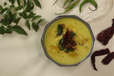Parippu, or boiled moong dal curry, is tempered in coconut oil. Getty Images