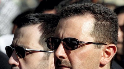 Bashar al-Assad (R) and his brother Maher Al Assad, the two brothers seen as after their tycoon cousin, Rami Makhlouf. AFP